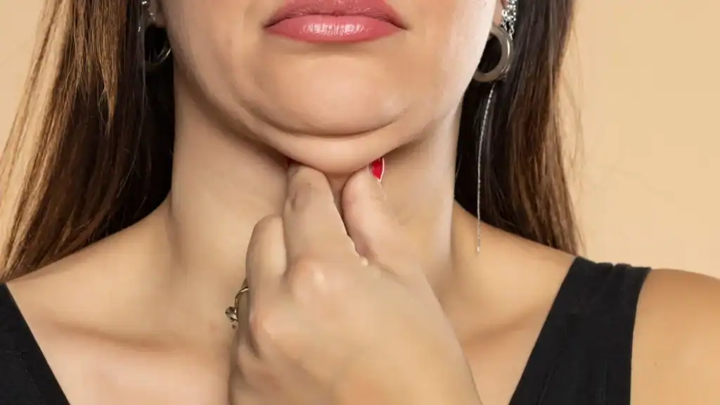 An image of a woman with double chin, sad, worried : Non Surgical Double Chin Removal Treatment in Coatbridge, UK